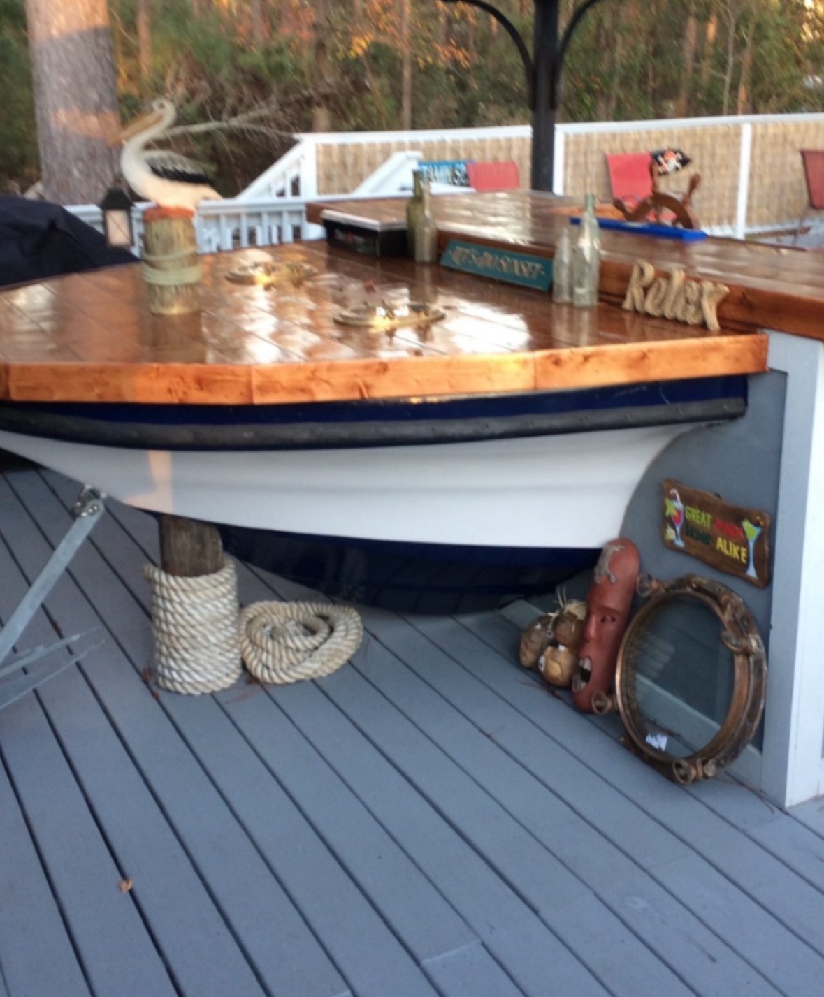 Bar built into a boat hull with a stained plank top