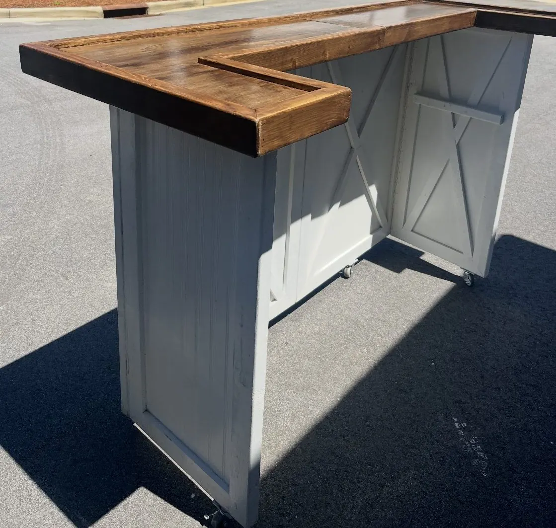 Rolling L-shaped bar with stained top and white X-brace panels