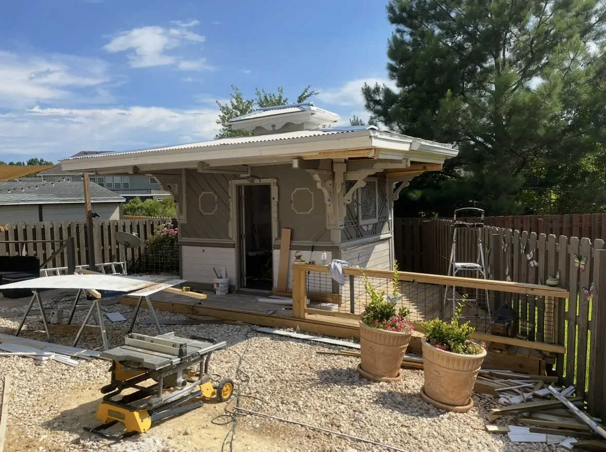 Finished backyard cabana with cupola, carved brackets and octagon trim panels