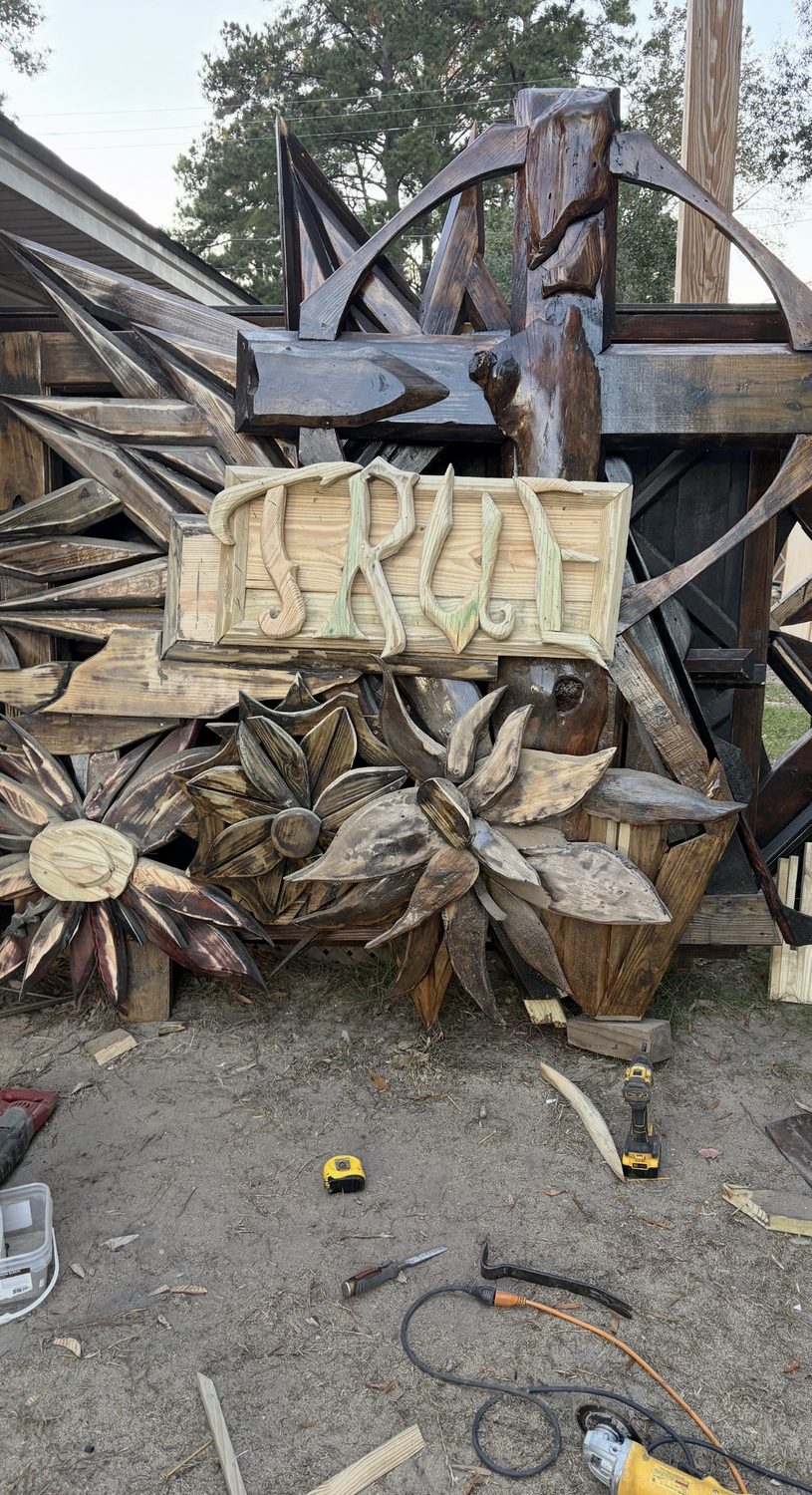 Group of large carved wooden florals and starbursts