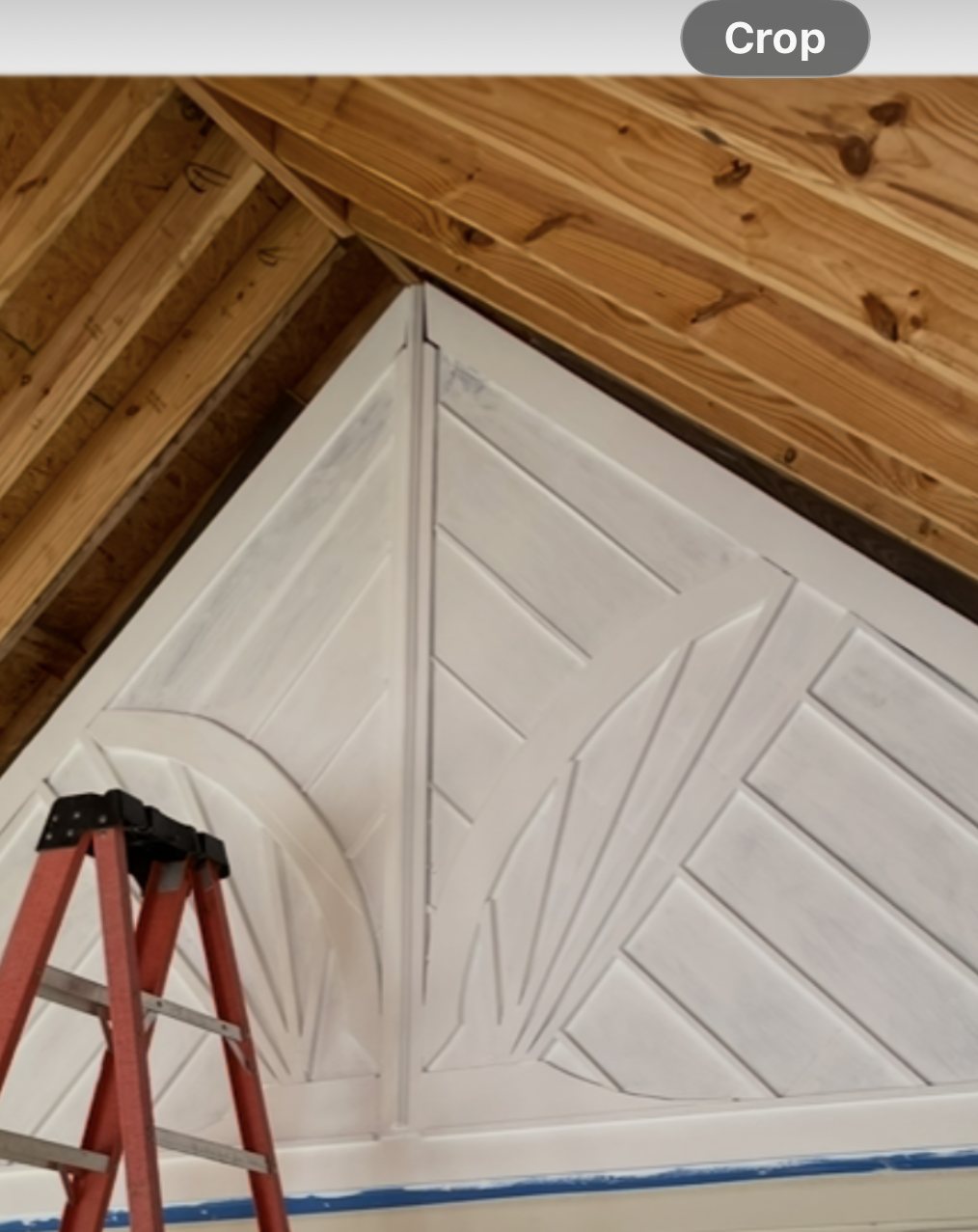 Carved sunburst panel set into a porch gable