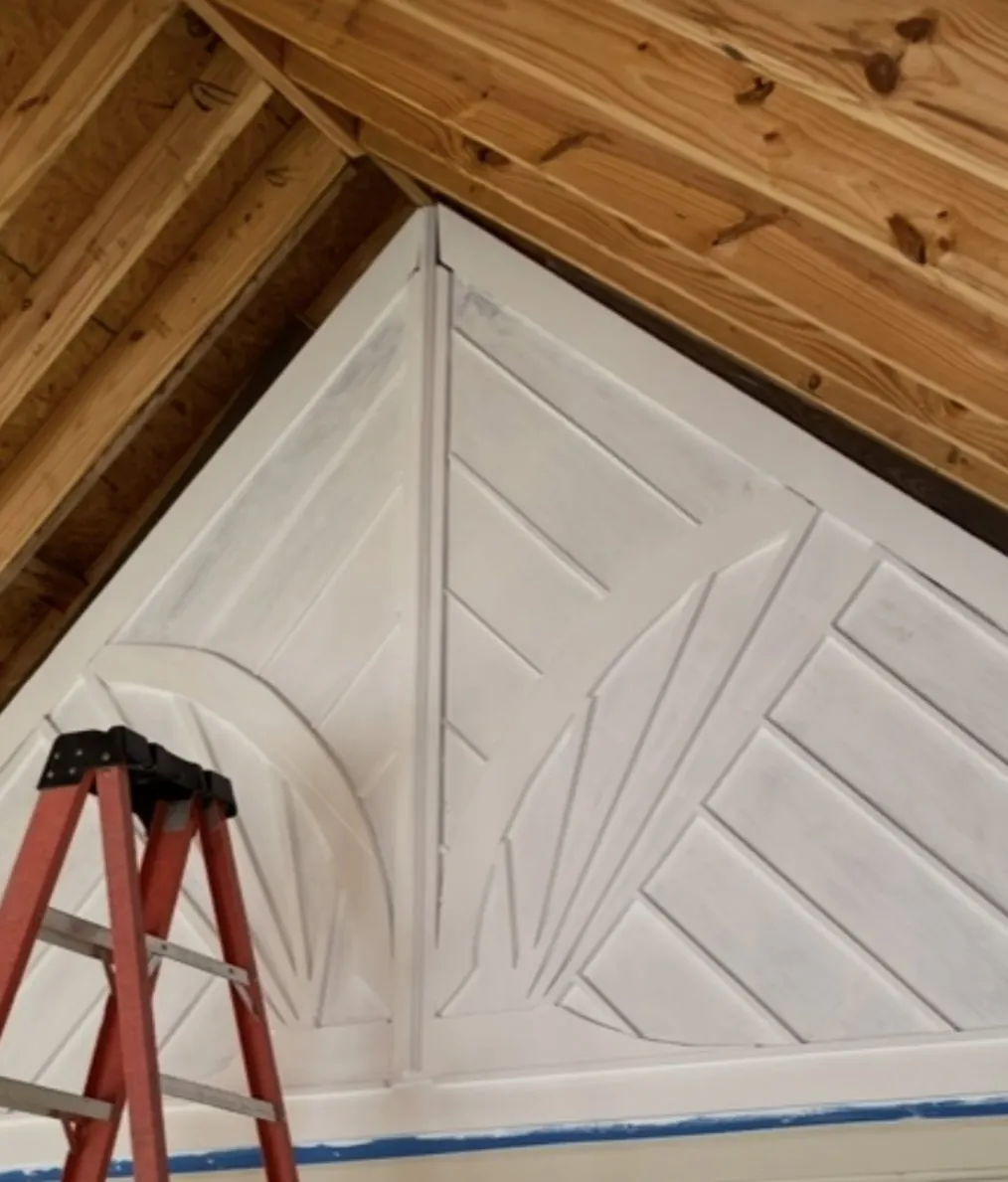 Carved sunburst panel set into a porch gable