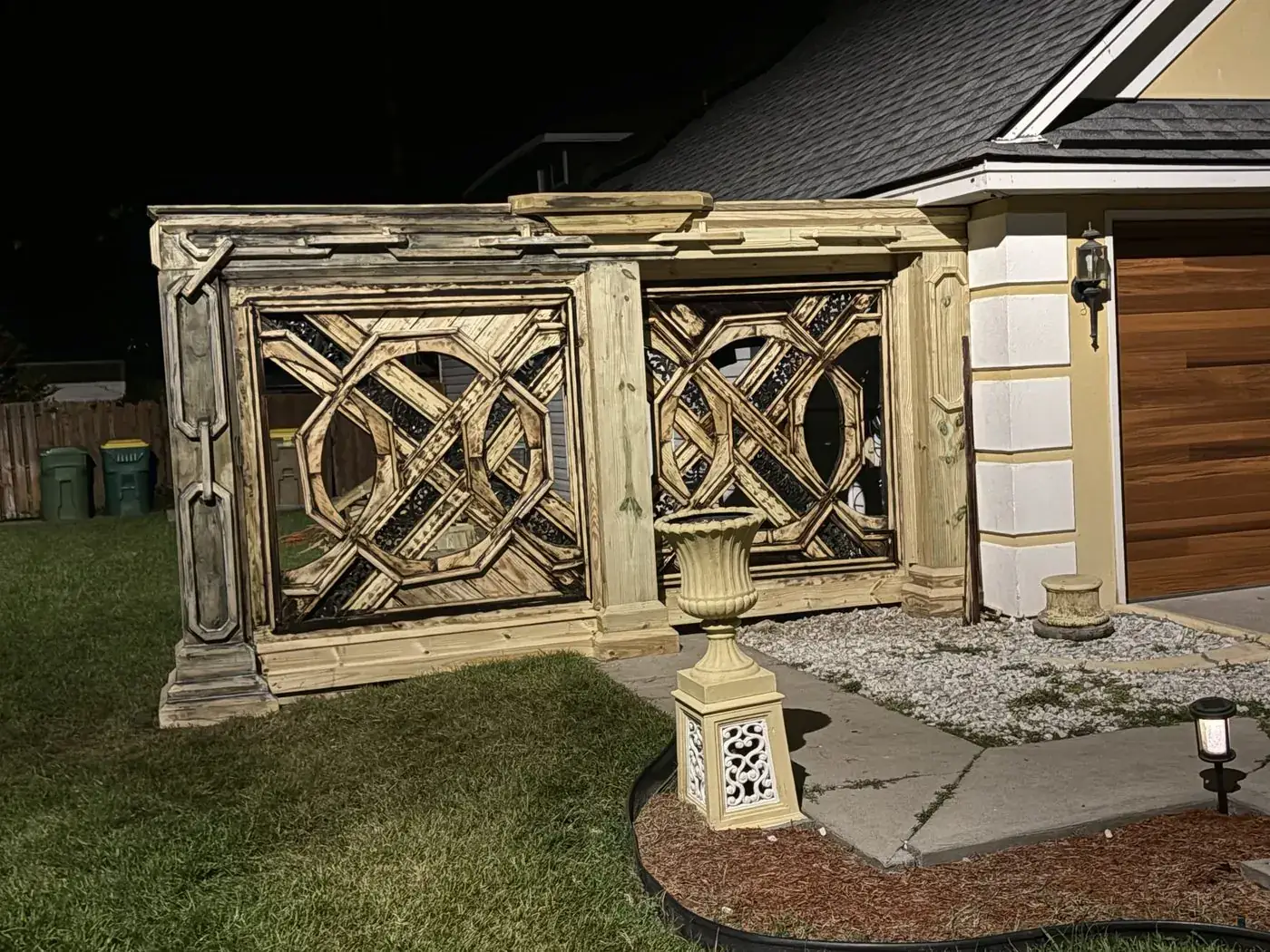 Close view at night of the first pass of finish on the lattice and columns