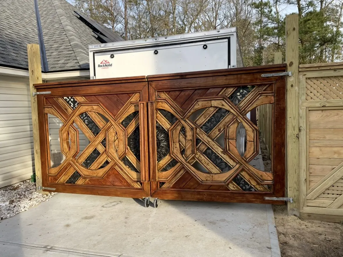 Finished stained gate pair with iron inlay behind the octagon lattice