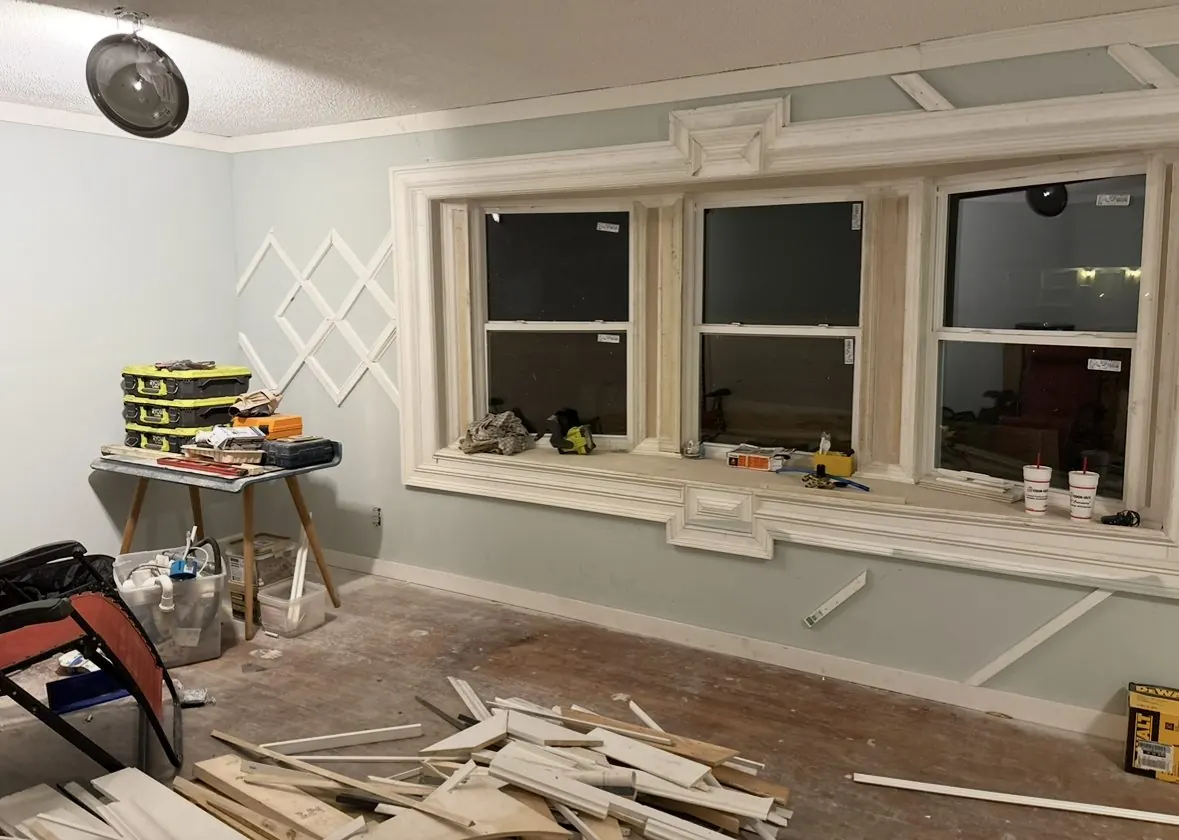 Window wall with built-up casing and crown, trim work in progress