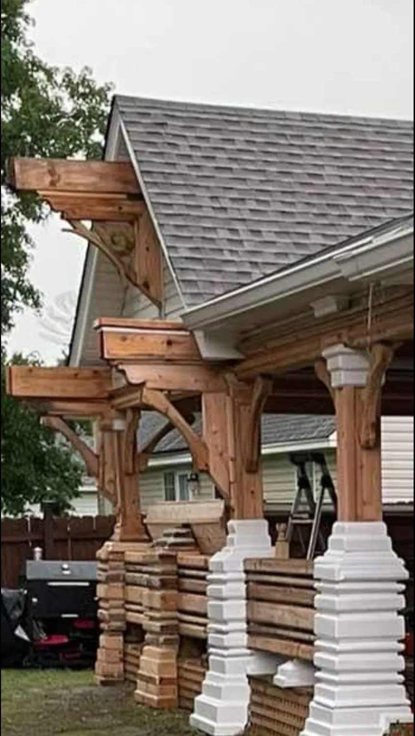 Carved corbels and brackets on a cedar pavilion