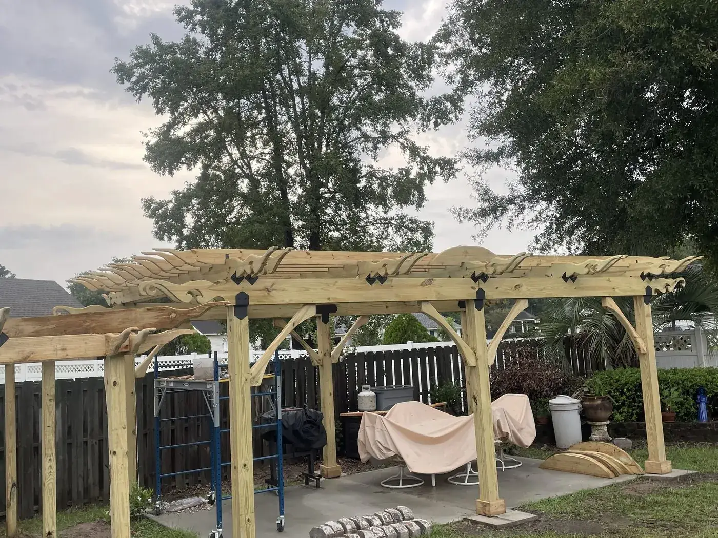 Finished carved header and rafter run seen from the patio